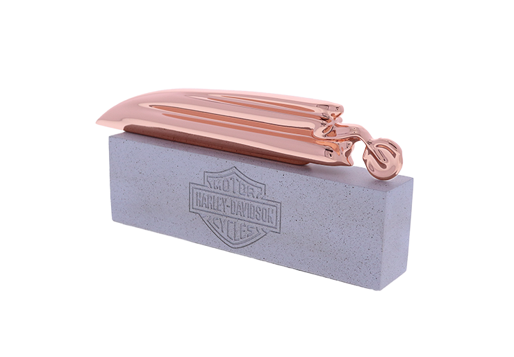 Harley Davidson bronze abstract speeding motorcycle atop a stone base